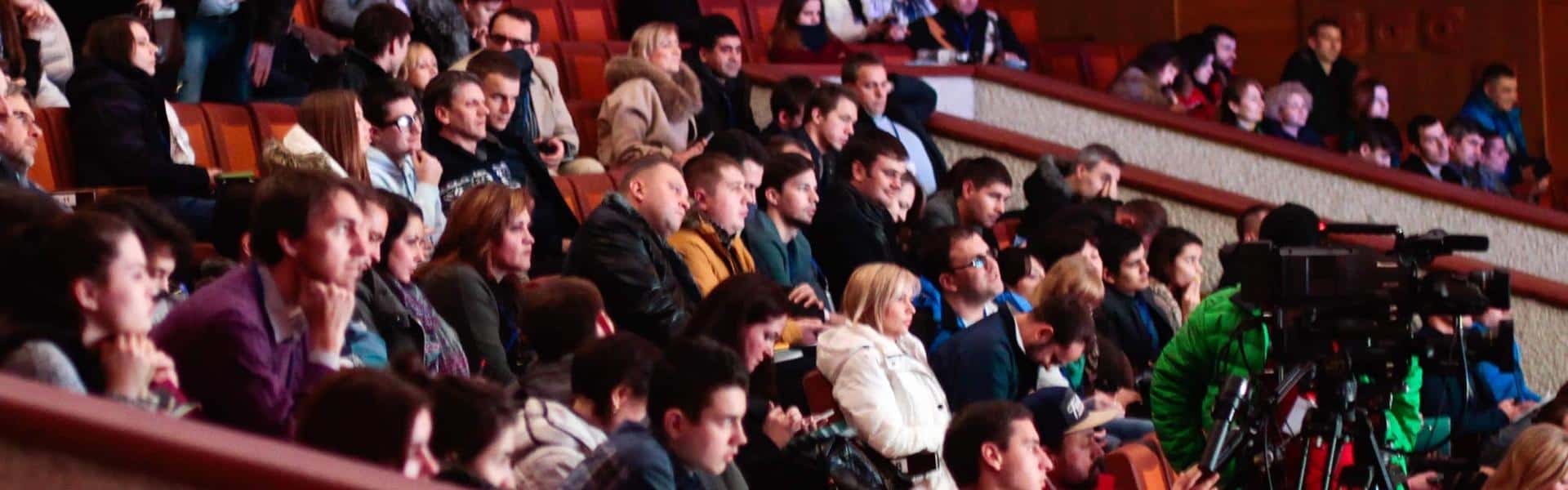 People sitting watching in the theater