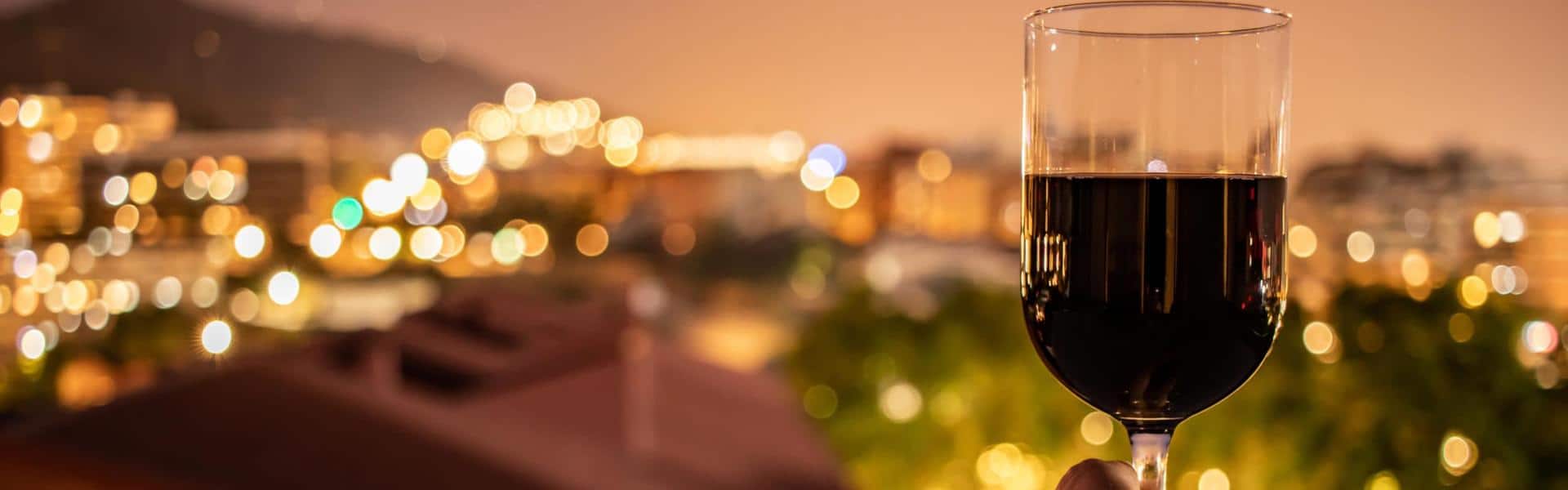 Photo of person holding wine glass