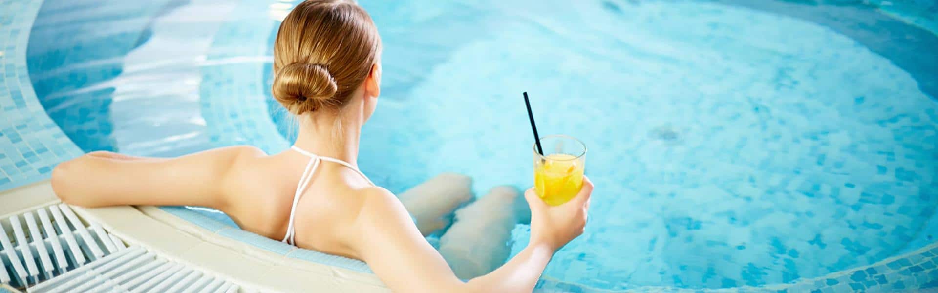 Rear view of woman in the hot tub