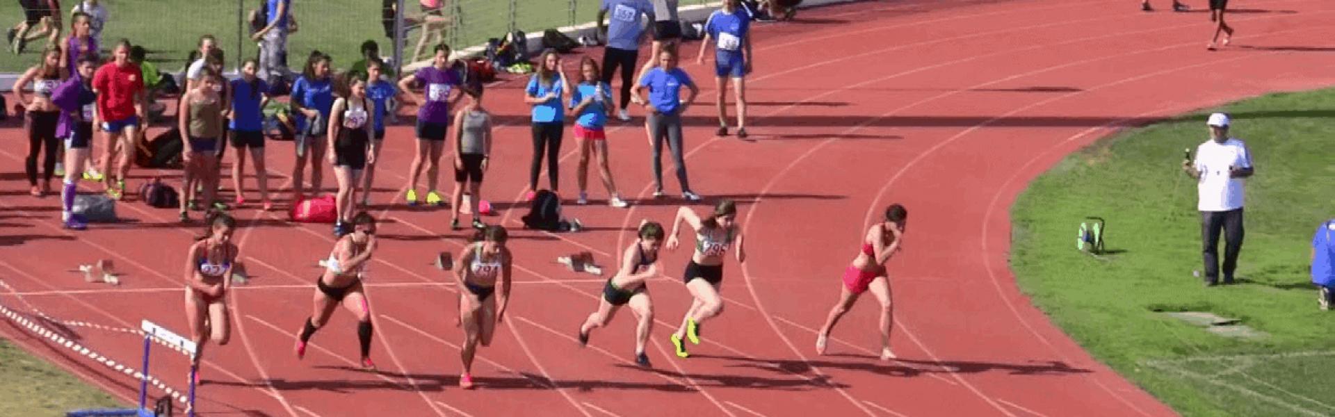 Athletes run in a stadium