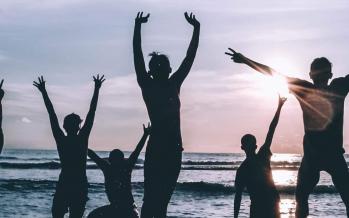 Silhouette of people by the seashore