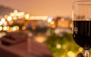 Photo of person holding wine glass