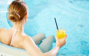 Rear view of woman in the hot tub