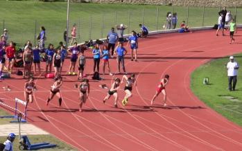 Athletes run in a stadium