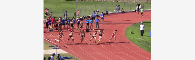 Athletes run in a stadium